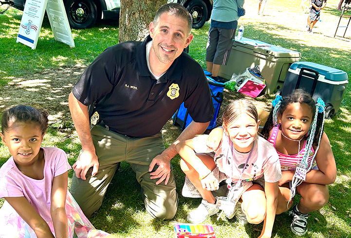 officer doing chalk activities with kids