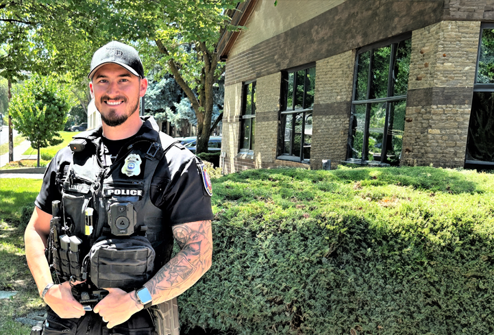 officer standing in front of building