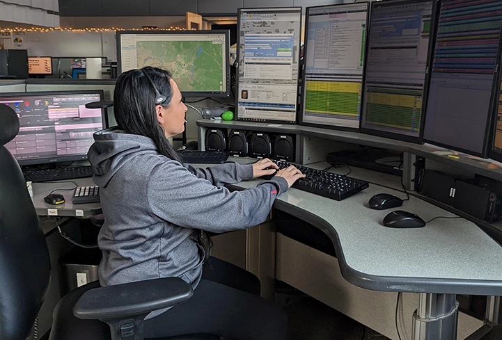 police radio dispatcher sitting at desk